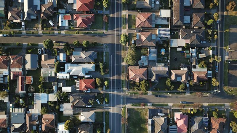 Aerial view of a neighborhood street grid lined with houses